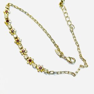 vintage Avon gold-tone floral rhinestone ankle bracelet with purple &clear stone